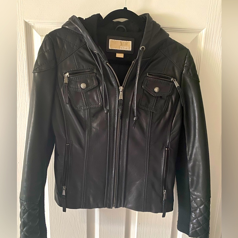 Michael Kors women’s black medium sized leather jacket with hood.